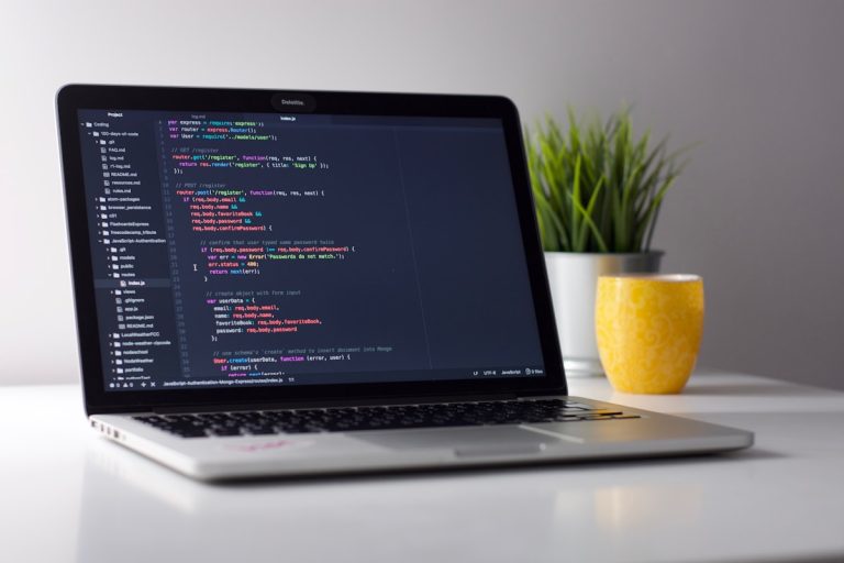 Developer workspace with code on screen - AI coding tools
